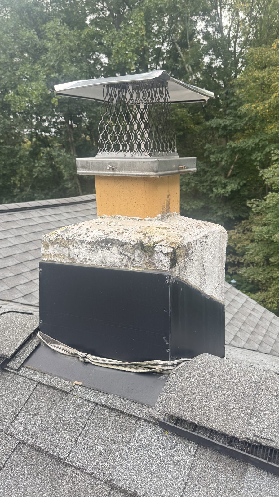 Chimney in Boonton, NJ during a FlueRite job with the roof opened at the base for flashing repair, before a new liner and cap