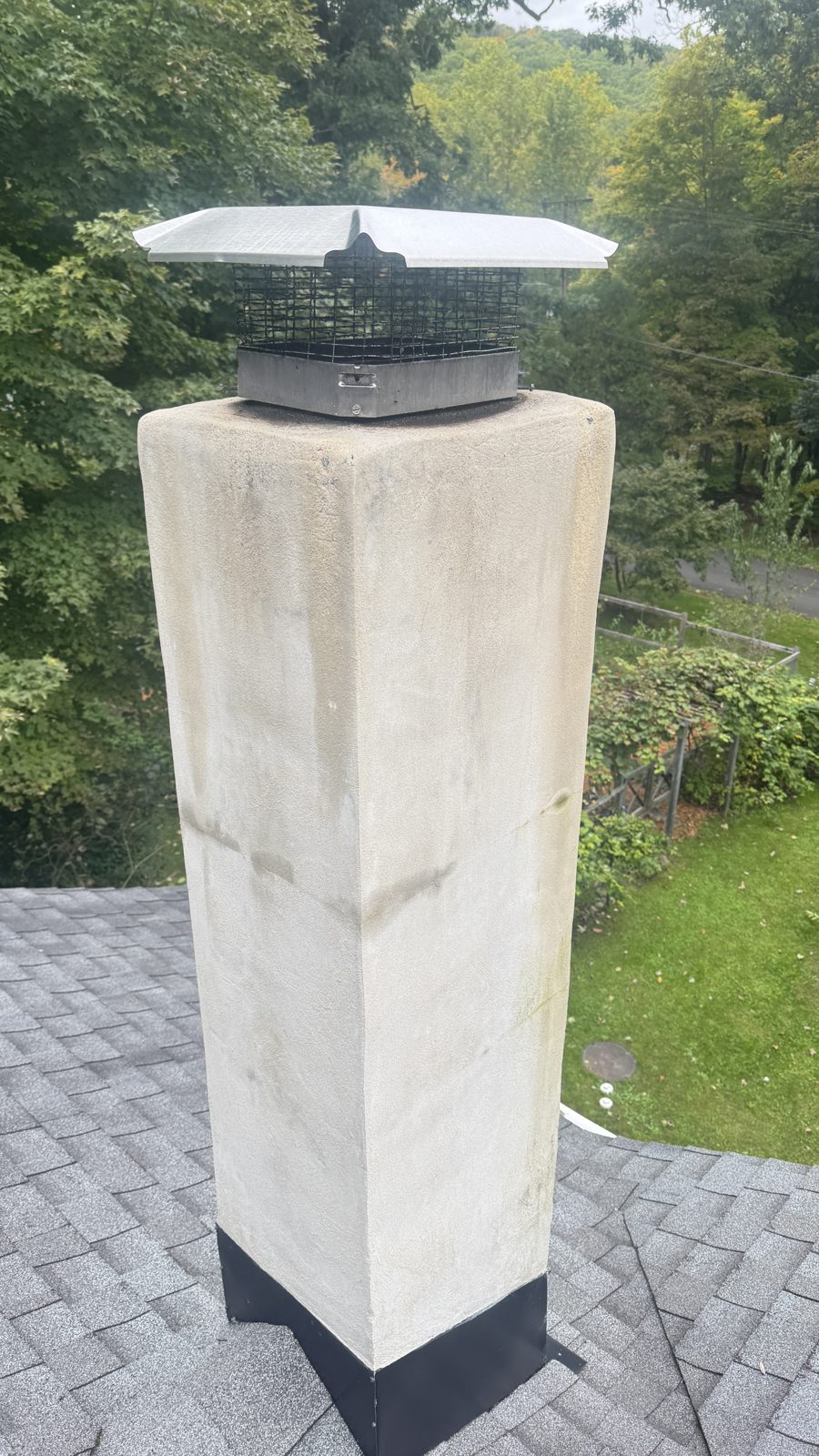 Stucco chimney in Parsippany, NJ where FlueRite swept the flue and installed a stainless steel chimney liner