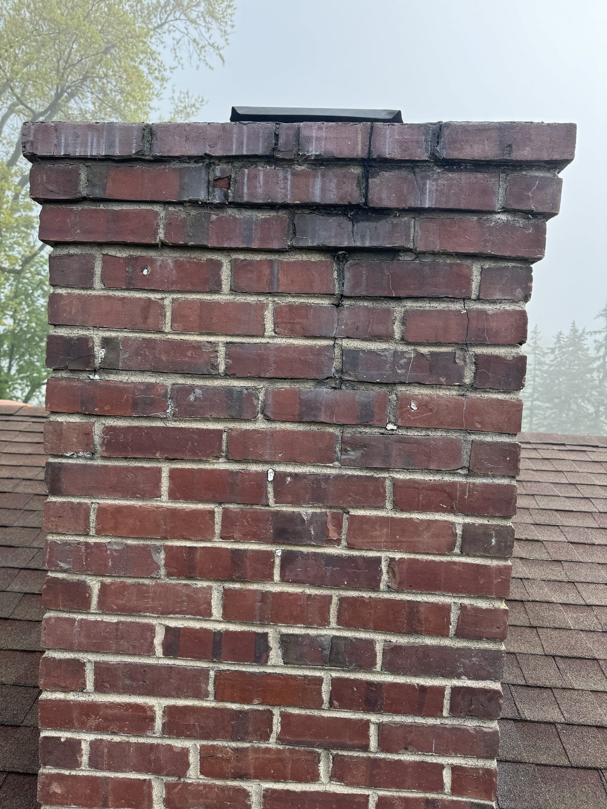 Cracked mortar joints and a vertical crack in a Basking Ridge NJ chimney before repointing