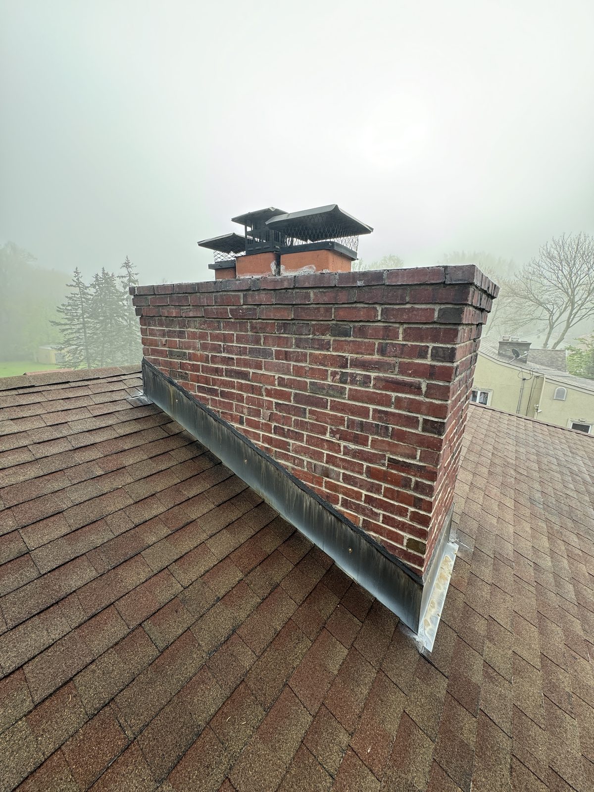 New chimney step and counter flashing installed on a Flanders NJ roof