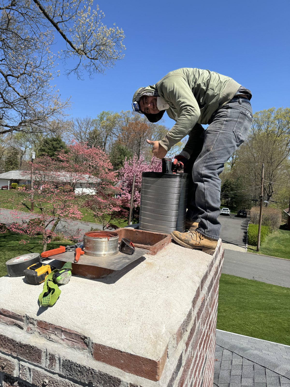 Stainless liner staged on a freshly poured chimney crown at a Hopatcong NJ home