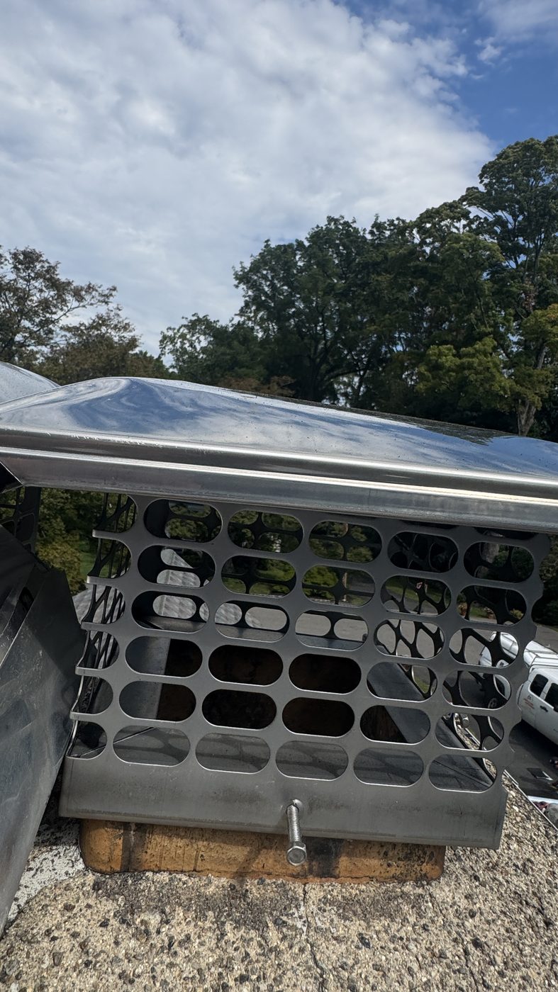 New stainless chimney cap installed in Morristown NJ after crown repair