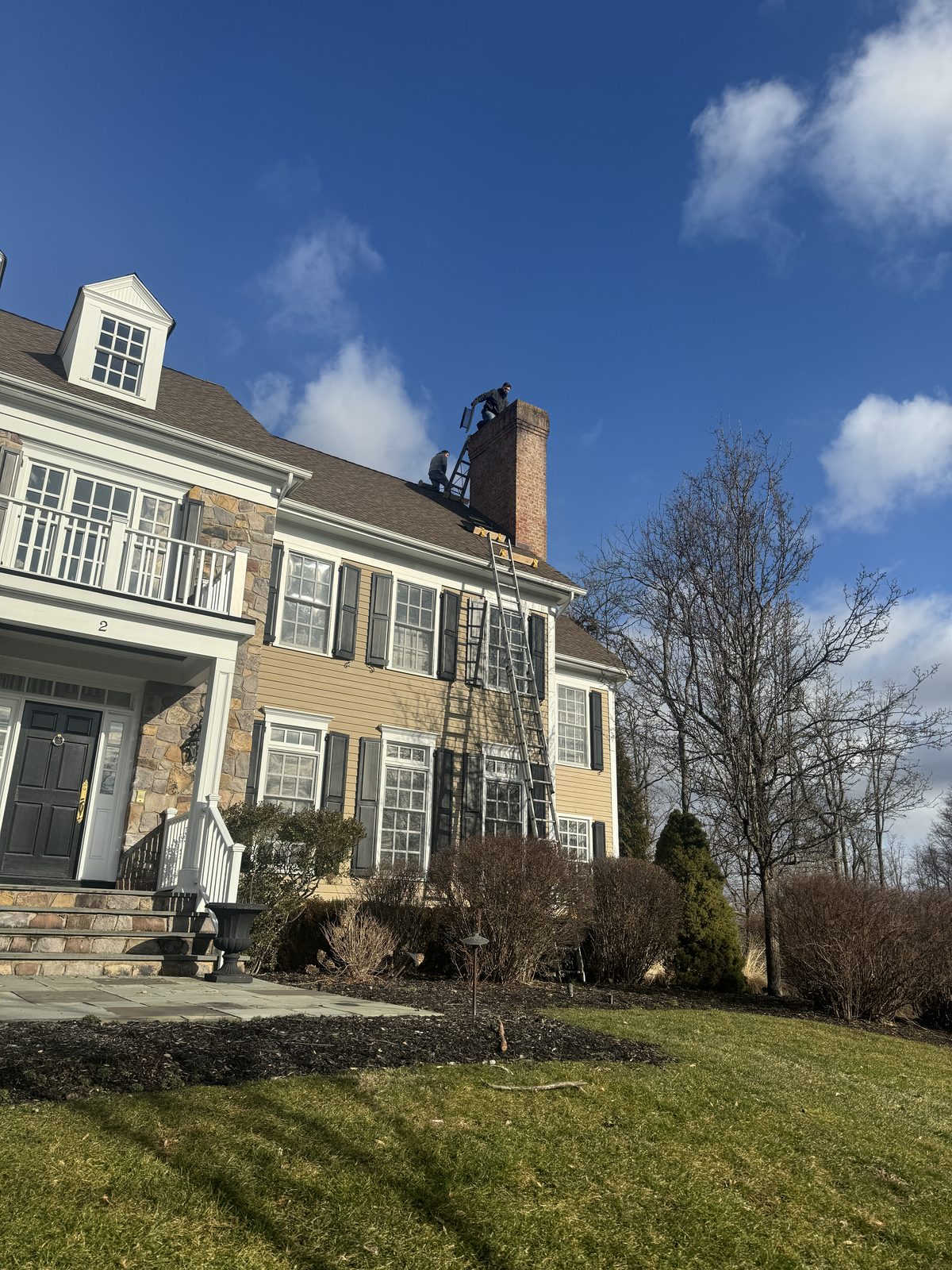 FlueRite crew accessing a chimney for an annual sweep at a Succasunna NJ home