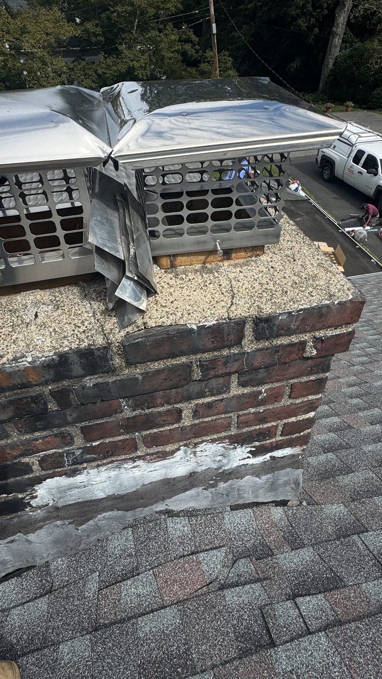 New stainless caps on a multi-flue chimney with crown work in Whippany NJ